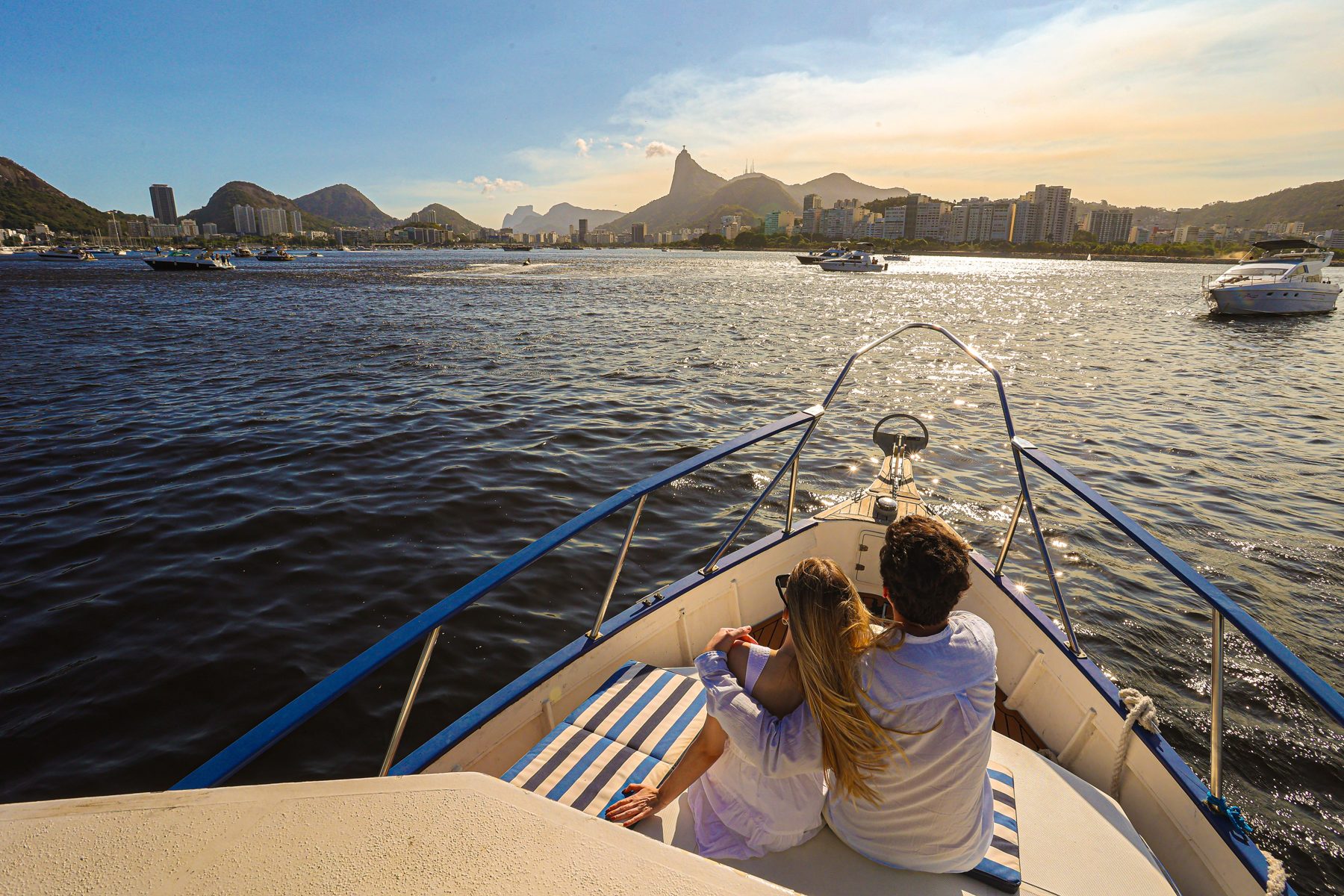 Seated together on the bow of a boat in Rio